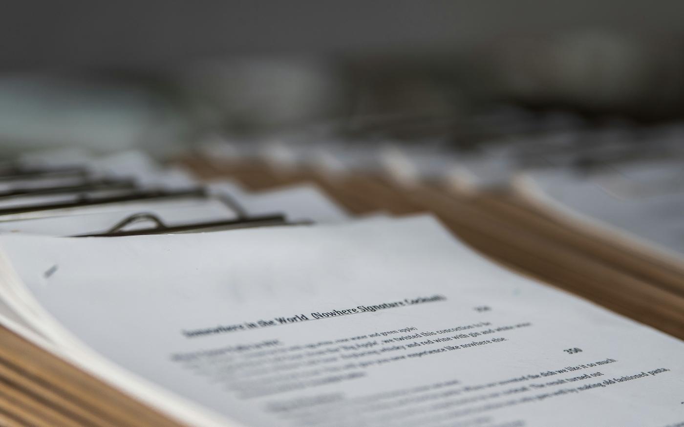 white printer paper close-up photography by Arisa Chattasa courtesy of Unsplash.