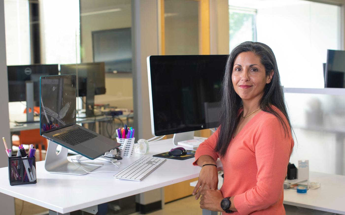 woman in orange long sleeve shirt sitting on chair by LinkedIn Sales Solutions courtesy of Unsplash.