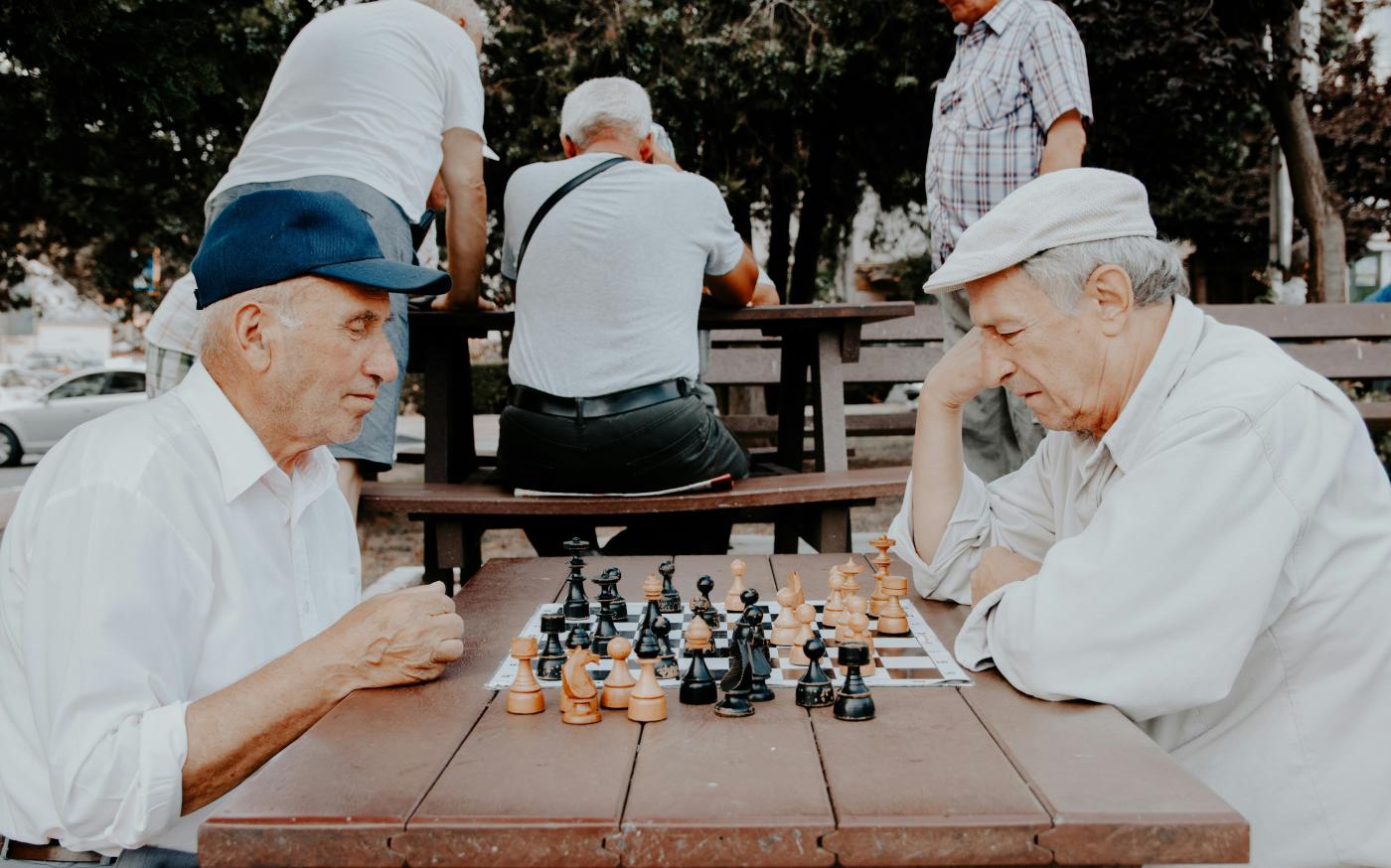 two men playing chess by Vlad Sargu courtesy of Unsplash.