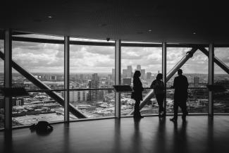 people standing inside city building by Charles Forerunner courtesy of Unsplash.