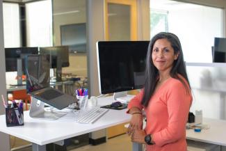 woman in orange long sleeve shirt sitting on chair by LinkedIn Sales Solutions courtesy of Unsplash.