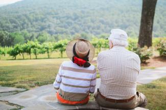 couple sitting on pathway by Christian Bowen courtesy of Unsplash.