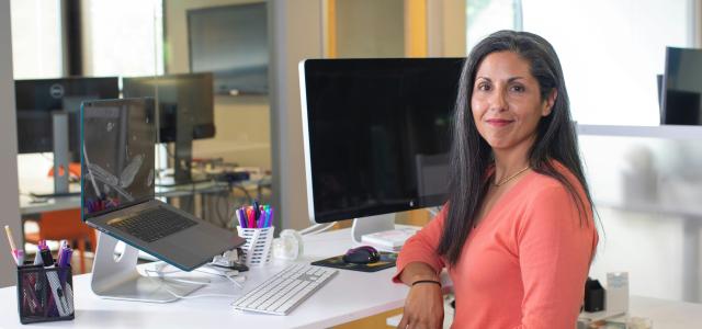 woman in orange long sleeve shirt sitting on chair by LinkedIn Sales Solutions courtesy of Unsplash.