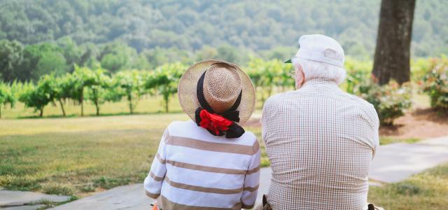 couple sitting on pathway by Christian Bowen courtesy of Unsplash.